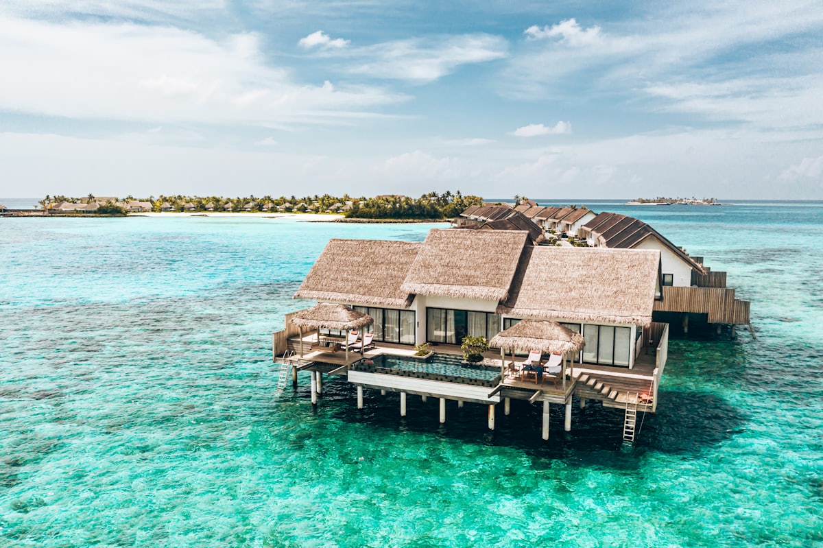 Low villas arranged around a shared body of water